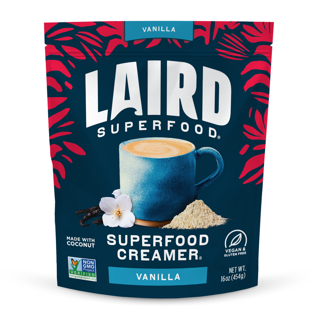 Laird Superfood Vanilla Creamer package with a blue mug and vanilla flower on a dark blue background.