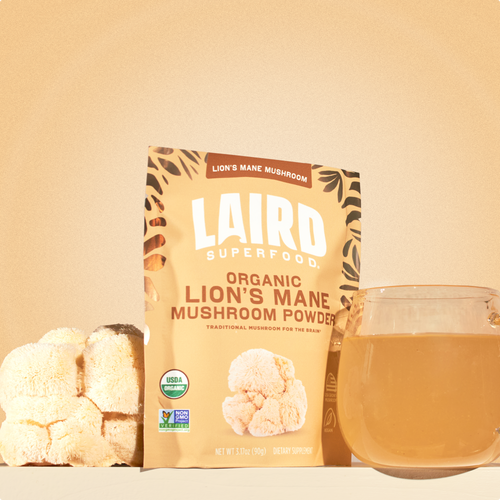 Laird Superfood lion's mane mushroom powder with the mushroom and a glass mug of the mushroom mix in water.