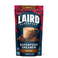 Front view of Laird Superfood Mocha Creamers with aquamin in a blue bag with red leafy highlight design.
