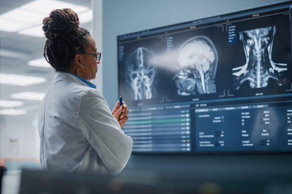 Female Doctor analyzing X Ray Sheets