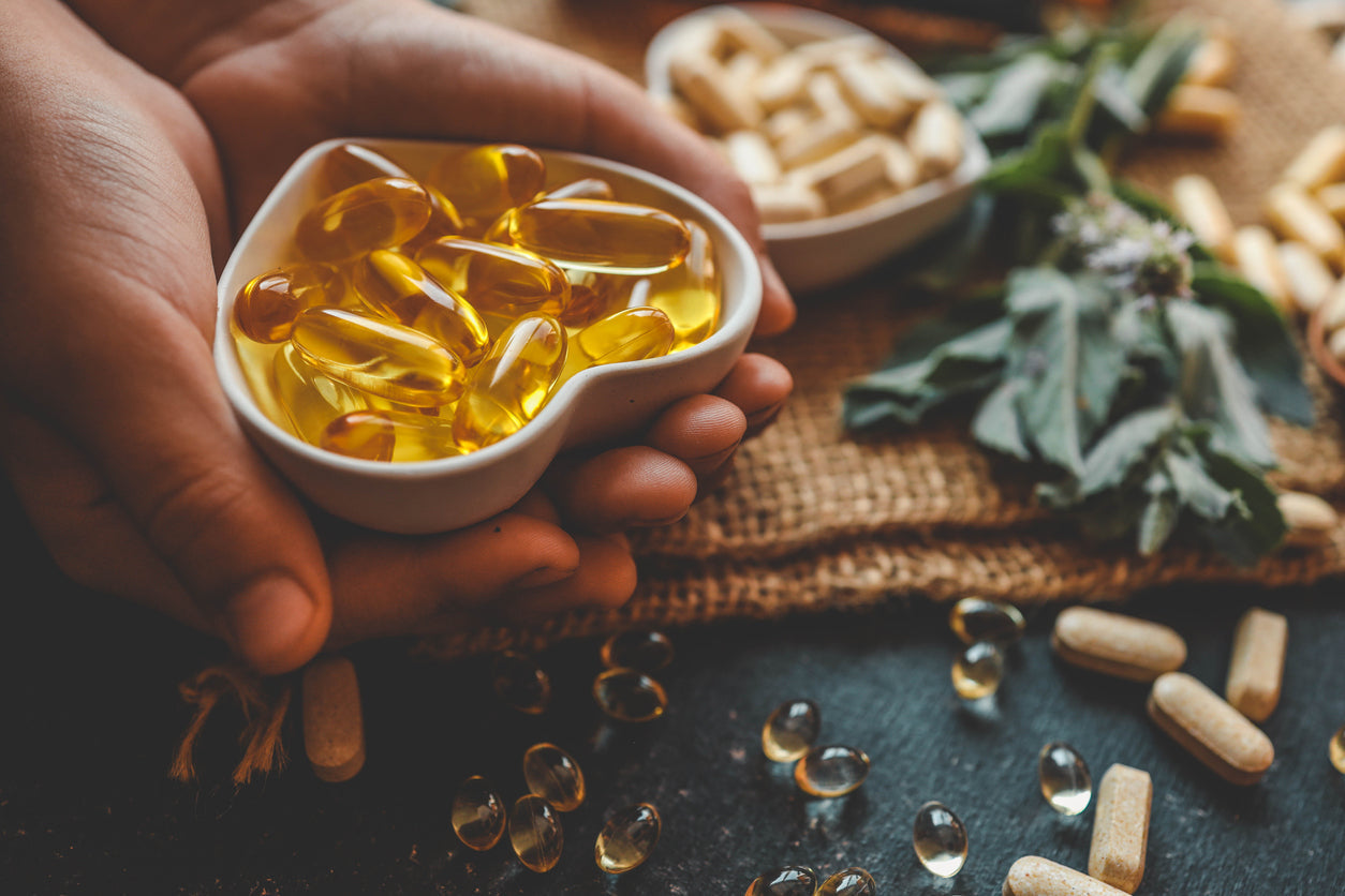 Vitamin D supplements next to natural sources. 