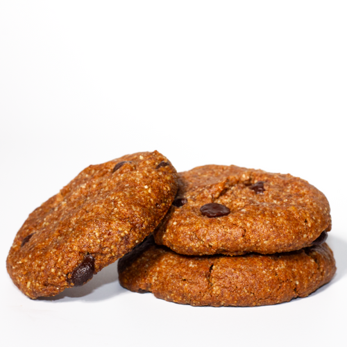 3 freshly baked cookies stacked with a white background 