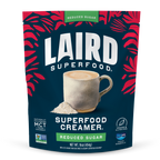 Laird Superfood Creamer package with a cup of coffee and red leaf pattern on a white background