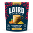 Laird Superfood Turmeric Creamer package with a cup and turmeric powder on a blue background