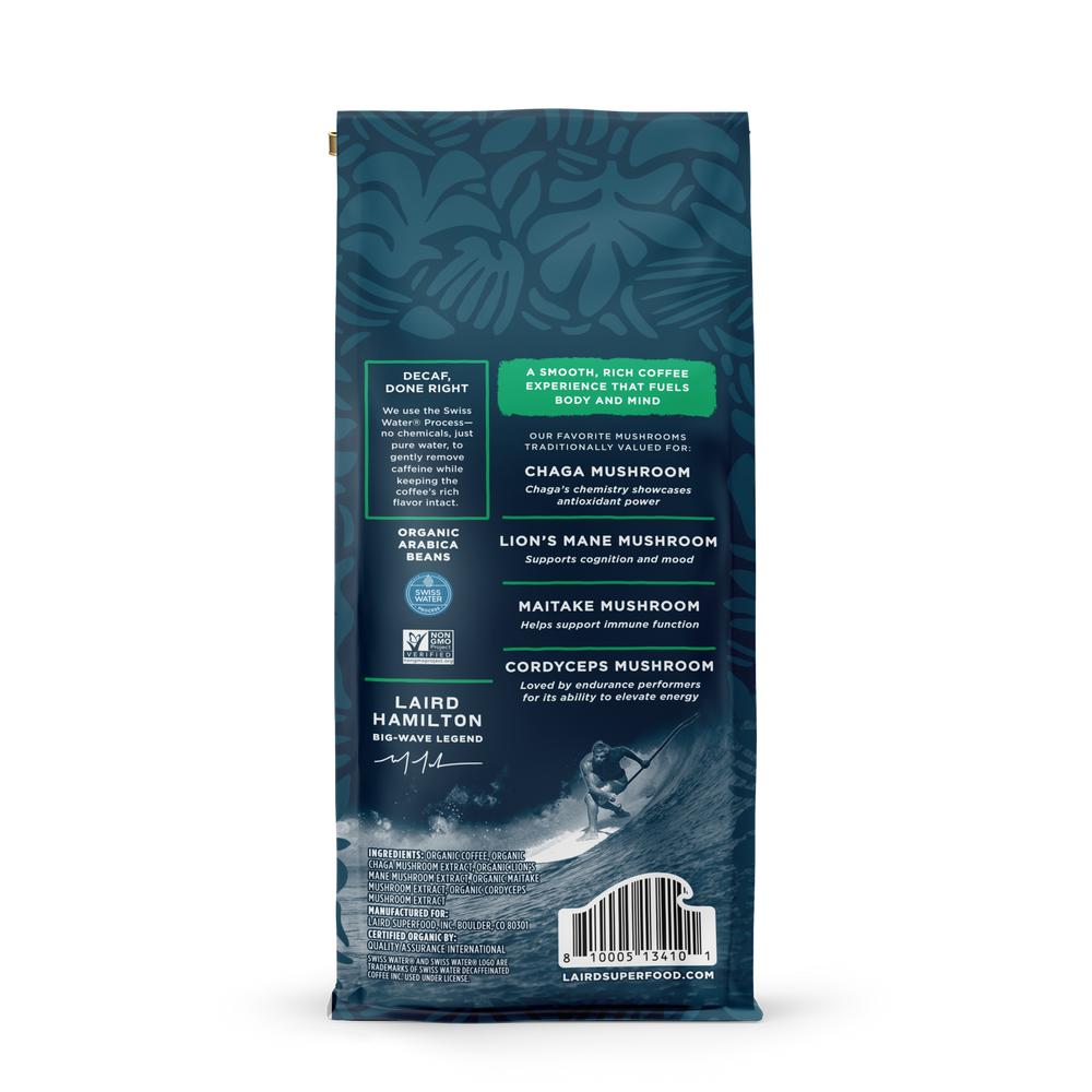 Back view of decaf coffee bag with blue leafy pattern, highlighting organic Arabica beans and mushroom blend benefits.