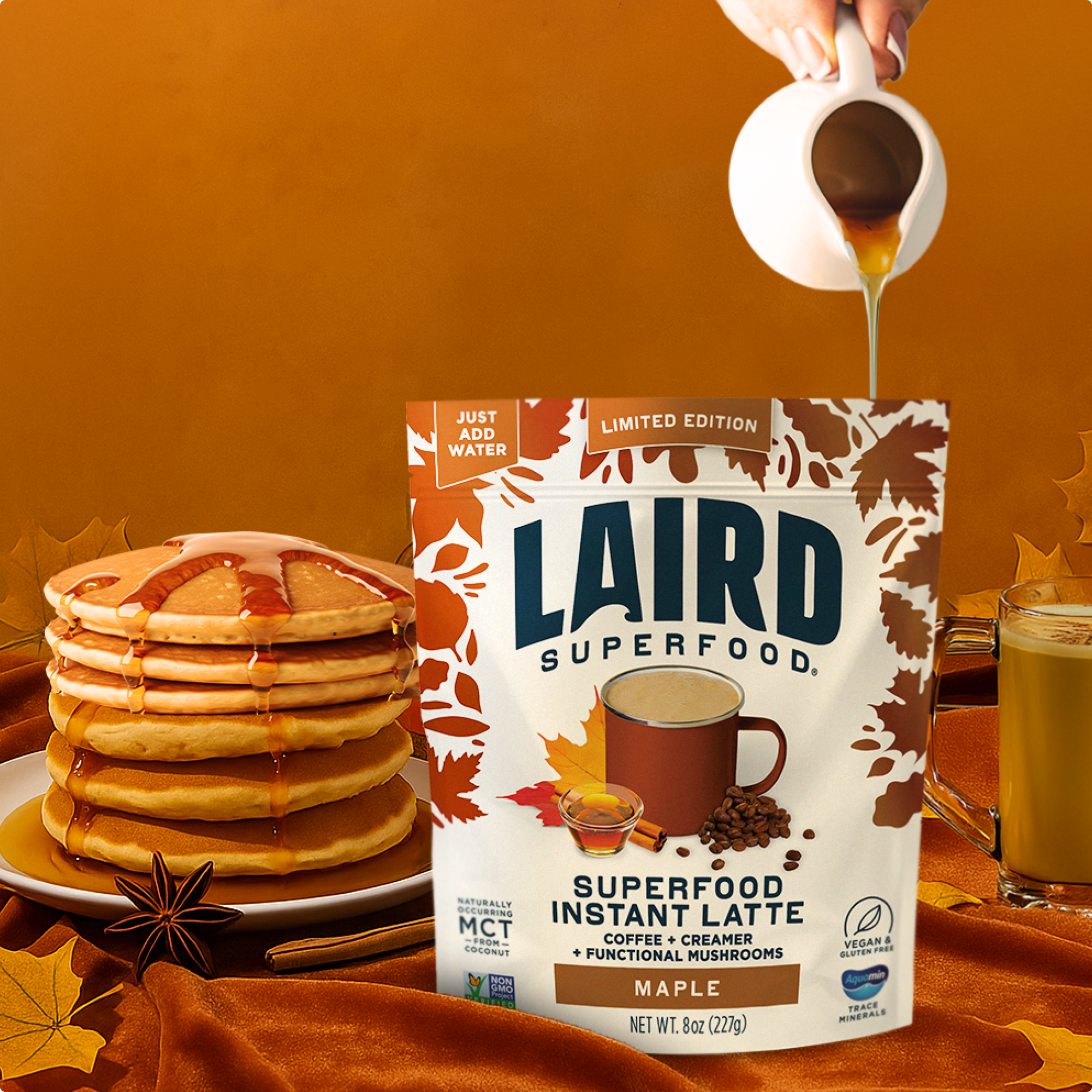 Laird Superfood Instant Latte package with pancakes and syrup on an orange background