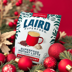Laird Superfood Instant Latte package surrounded by festive decorations