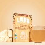 Laird Superfood lion's mane mushroom powder with the mushroom and a glass mug of the mushroom mix in water. 