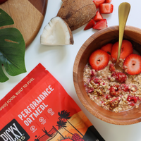 Picky Bar's Oatmeal with Berries and Cream prepared in a bowl with fresh strawberry slices